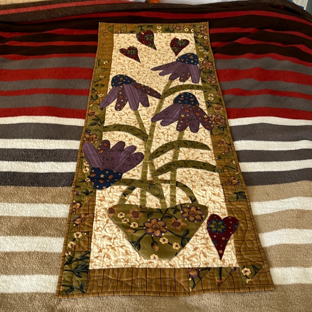 Handmade quilt wall hanging.